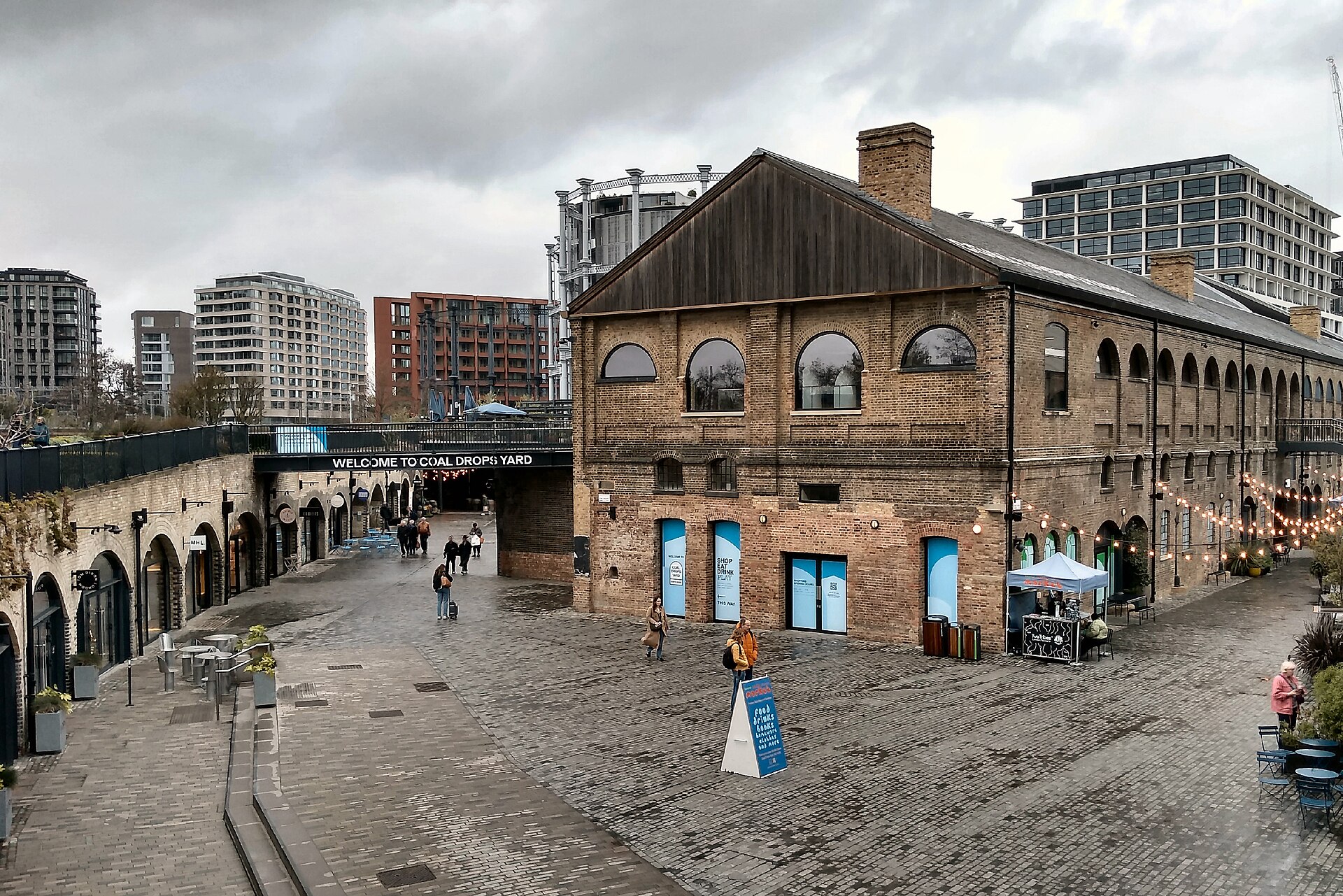 The brick arches and sweeping roofline of Coal Drops Yard at King’s Cross